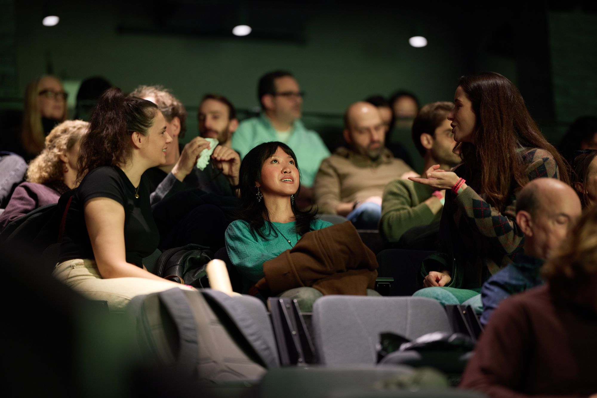 More attendees talk, laughing.